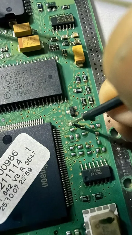Close-up of work on an electronic circuit board